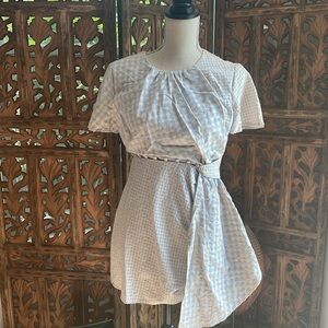 Unique design blue and cream checked dress.